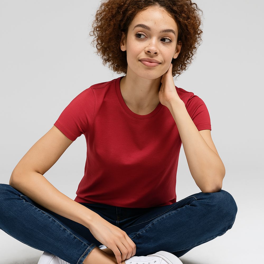 woman sitting and wearing red tech t-shirt – comfortable breathable outfit for casual and everyday wear