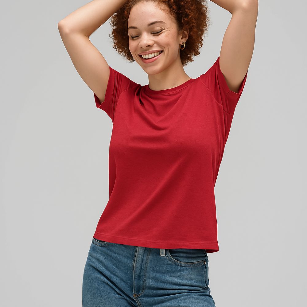 smiling woman wearing red tech t-shirt – lightweight breathable fabric for comfort, fashion and daily wear