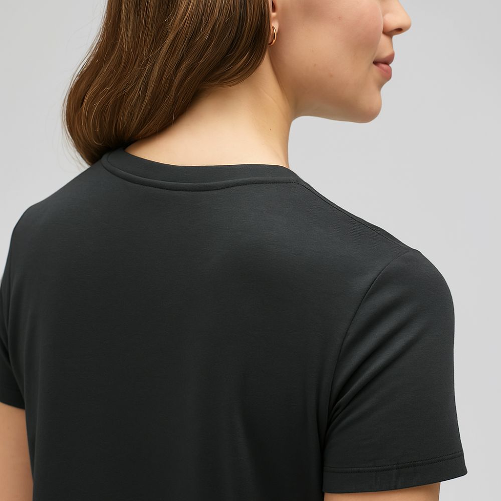 close-up back view of woman in black tech t-shirt – soft breathable fabric with minimalist cut for everyday wear