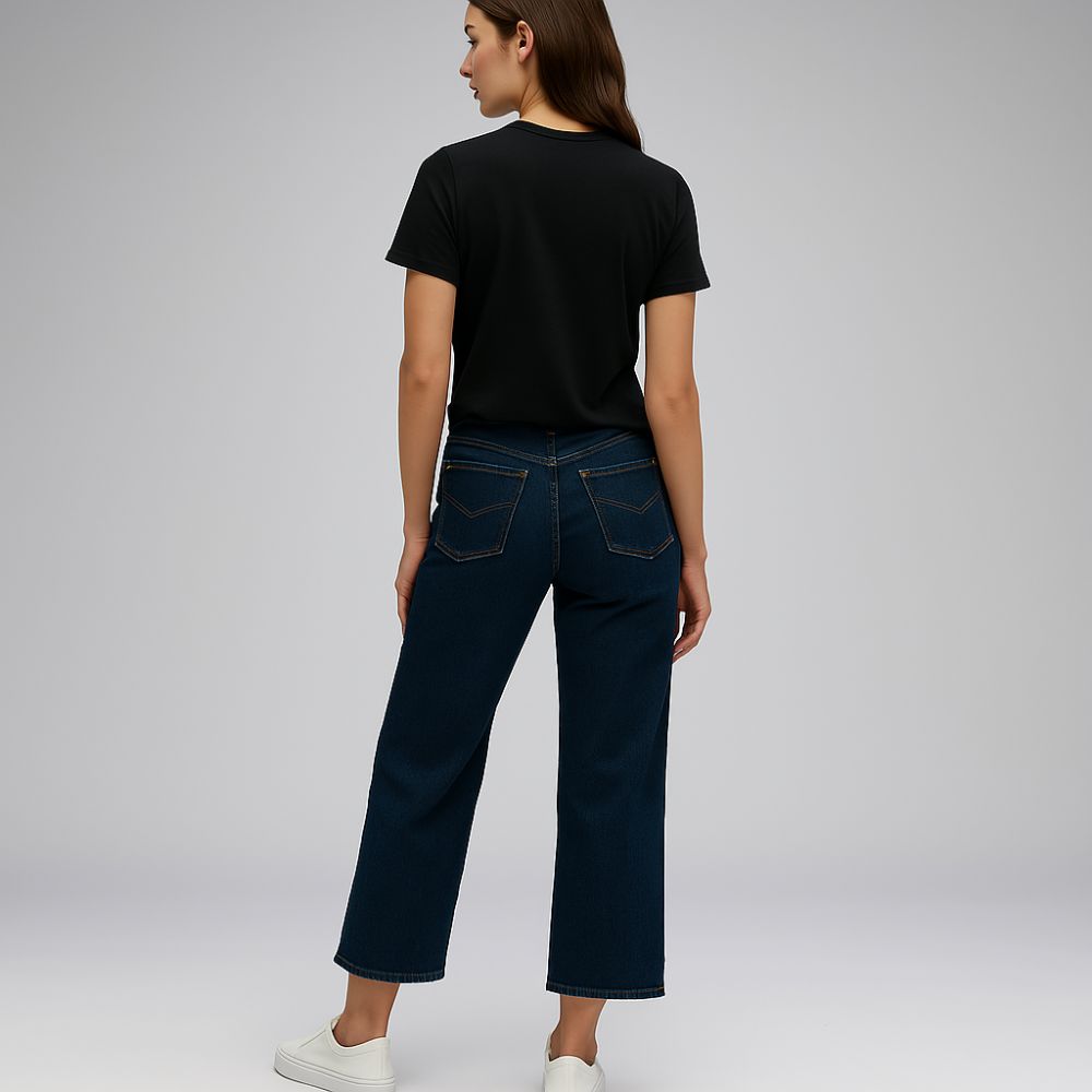 full back view of woman wearing black tech t-shirt – minimalist breathable fashion for casual everyday style