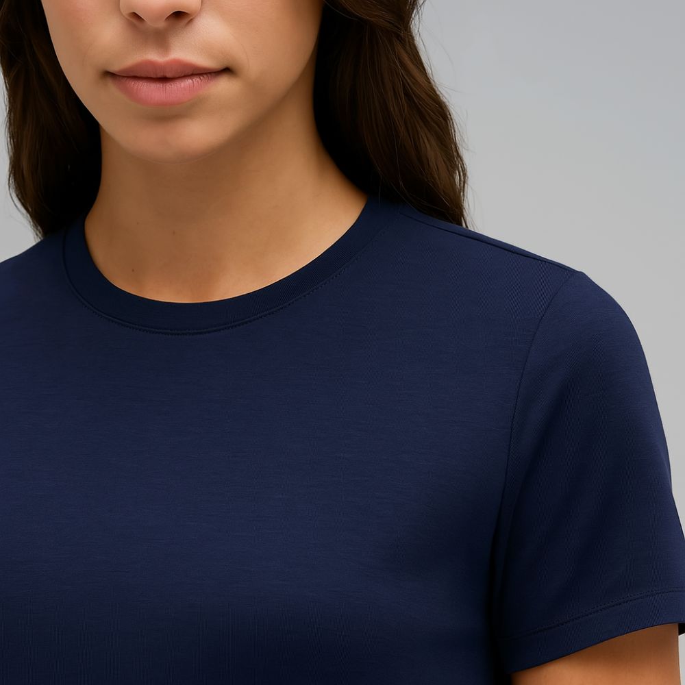 Close-up of navy blue women’s t-shirt highlighting soft cotton texture and minimalist crew neckline for everyday comfort