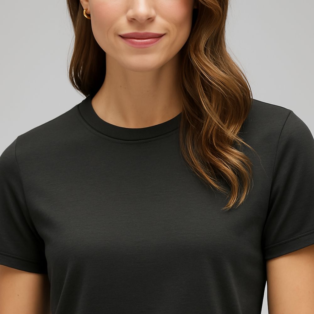 Close-up of woman wearing black tech T-shirt – breathable, quick-dry and soft-touch fabric