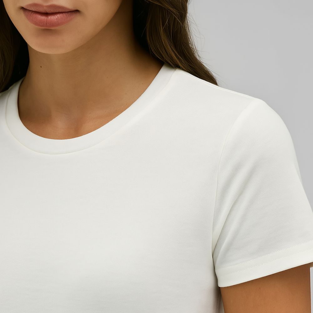 close-up of woman wearing white tech t-shirt – soft breathable fabric with minimalist cut and daily comfort