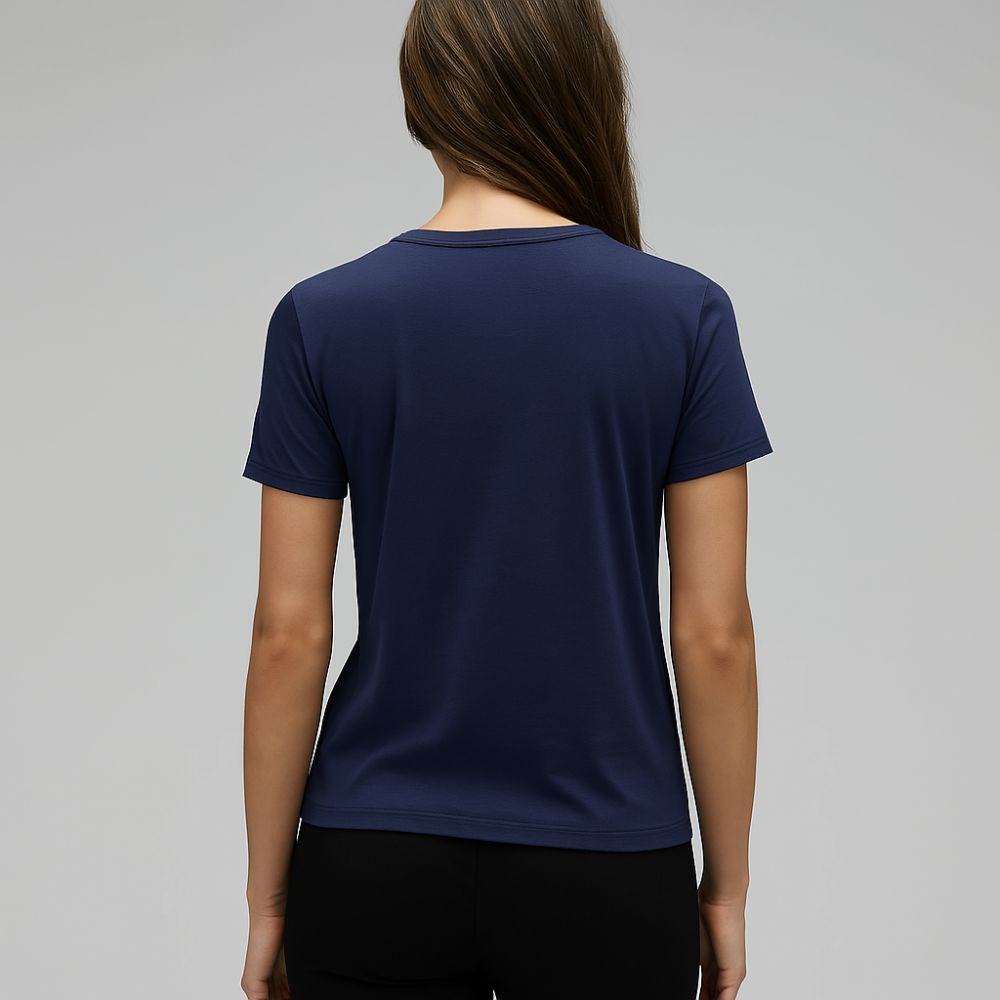 back view of woman in navy blue tech t-shirt – breathable lightweight fabric for minimalist everyday wear