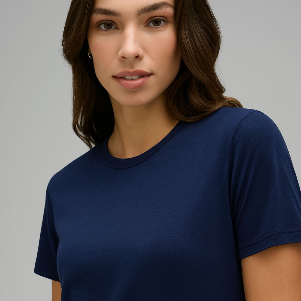 close-up of woman in navy blue tech t-shirt – soft breathable minimalist fabric ideal for gym, casual and modern lifestyle